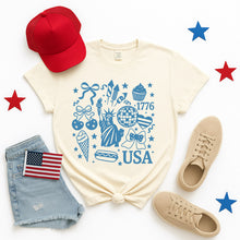 USA 1776 Patriotic Icons T-Shirt – Cream Graphic Tee for 4th of July, Summer, Fireworks & Freedom