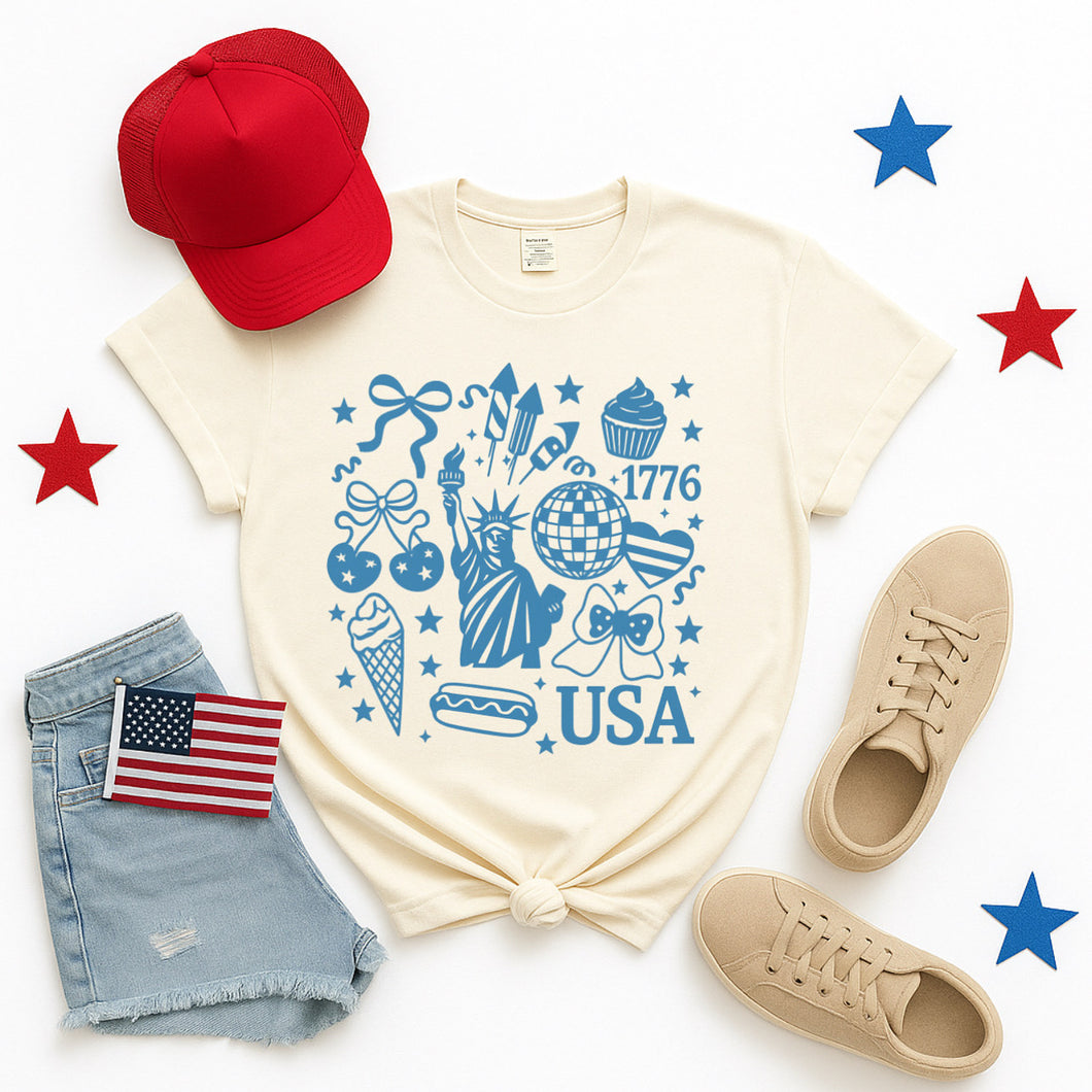 USA 1776 Patriotic Icons T-Shirt – Cream Graphic Tee for 4th of July, Summer, Fireworks & Freedom