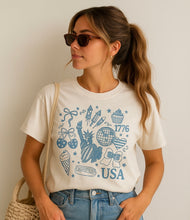 USA 1776 Patriotic Icons T-Shirt – Cream Graphic Tee for 4th of July, Summer, Fireworks & Freedom